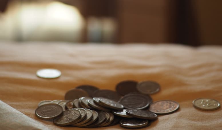 Coins On Table Showing The Affordability Of Digital Marketing Courses 1